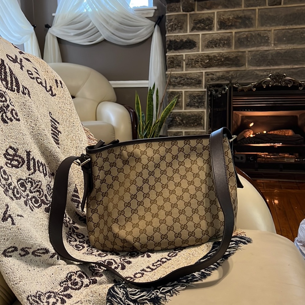 Authentic Gucci Handbag brown in color with adjustable strap